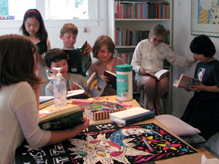 book group all gathered around together reading